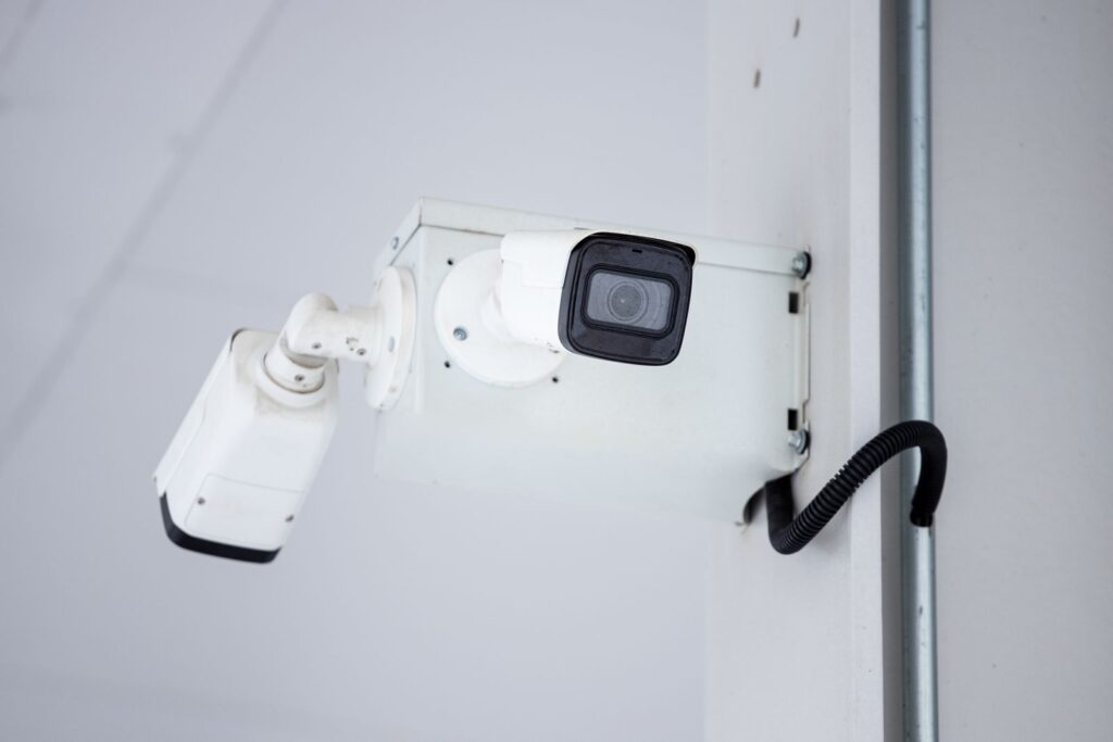 Professional business security cameras mounted on the corner of a building
