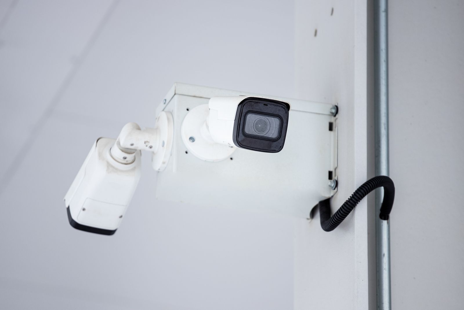 Professional business security cameras mounted on the corner of a building