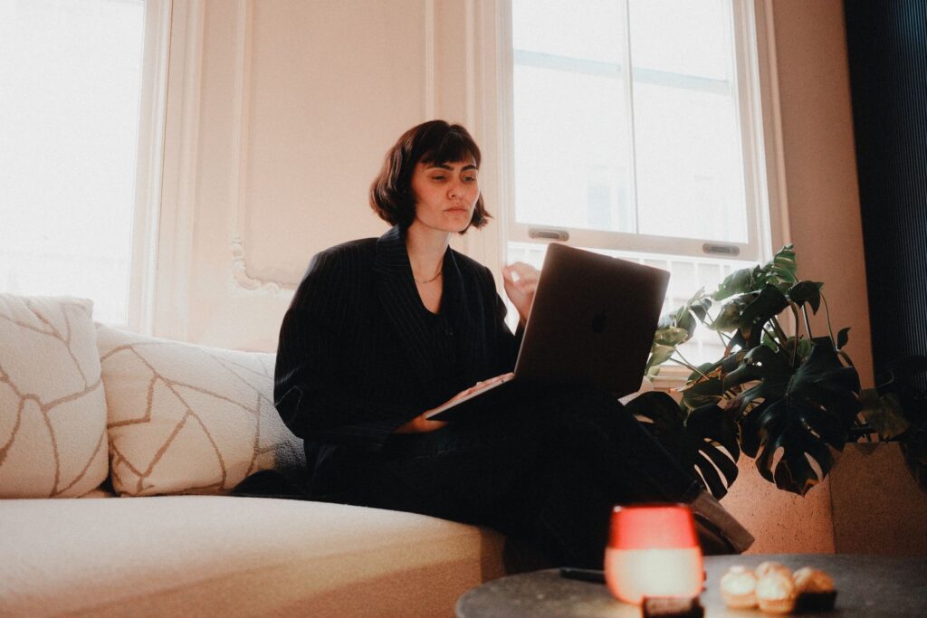 Small business employee working remotely on a laptop from a home office
