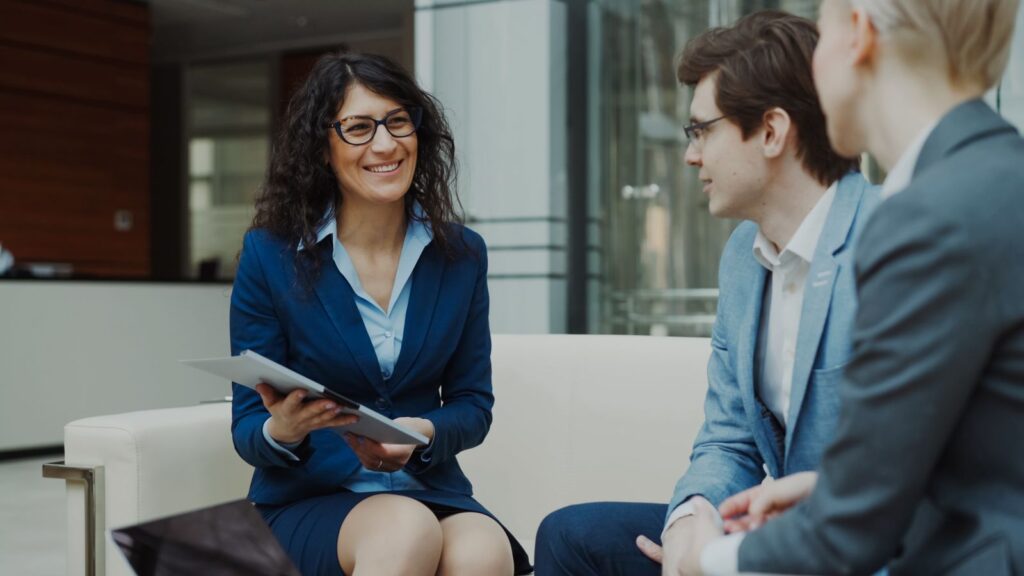 Business owner meeting with an IT consultant to review a support agreement