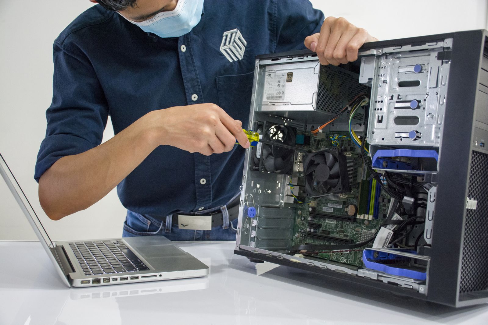 Technician providing computer support for a small business desktop PC