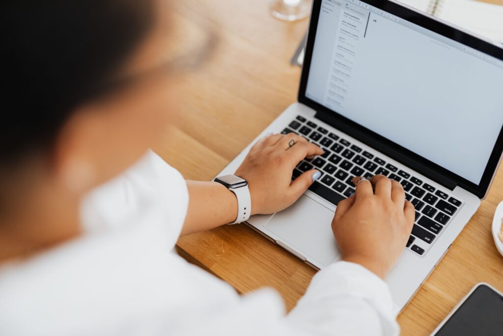 Business owner checking Microsoft 365 email on a laptop after an email migration
