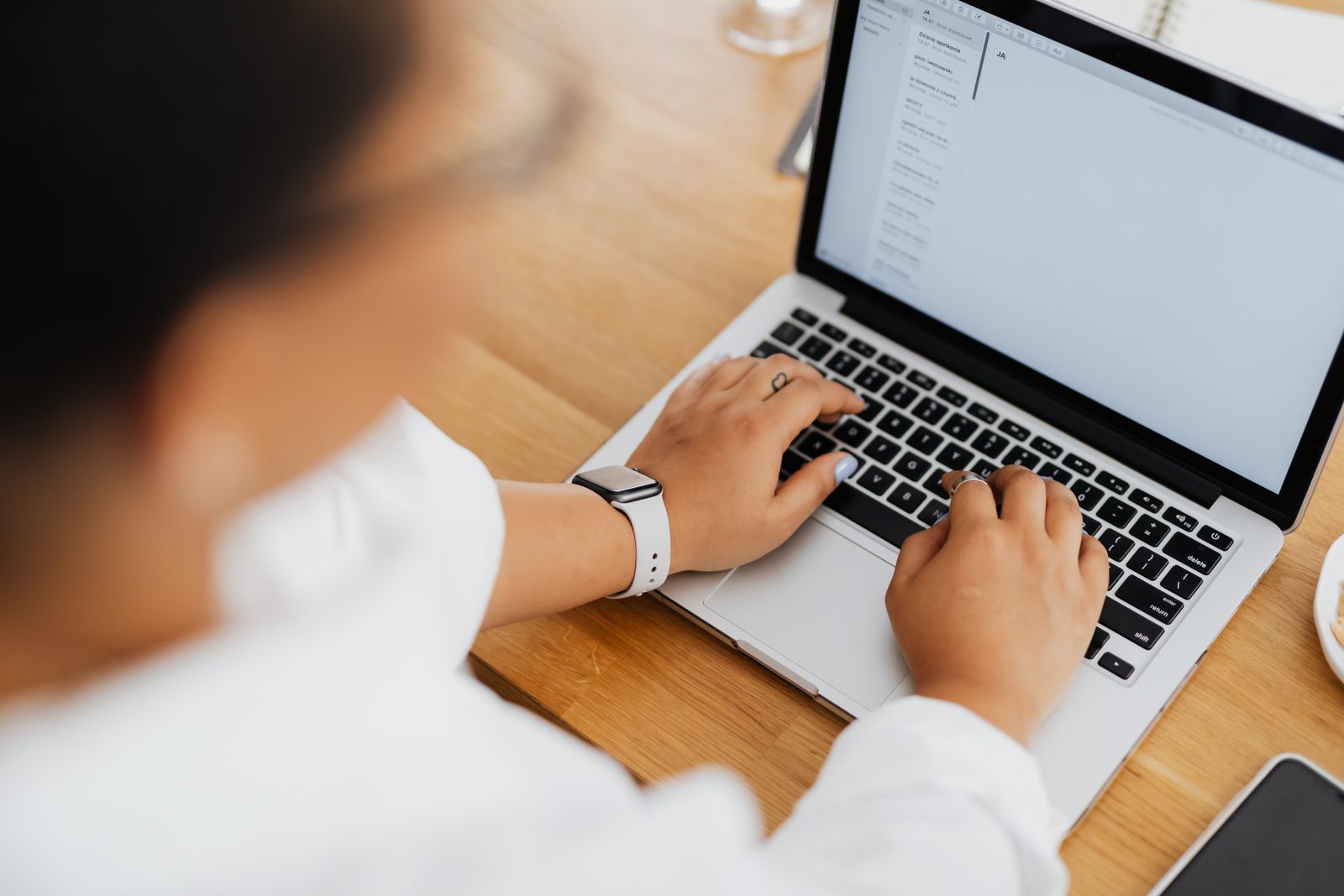 Business owner checking Microsoft 365 email on a laptop after an email migration
