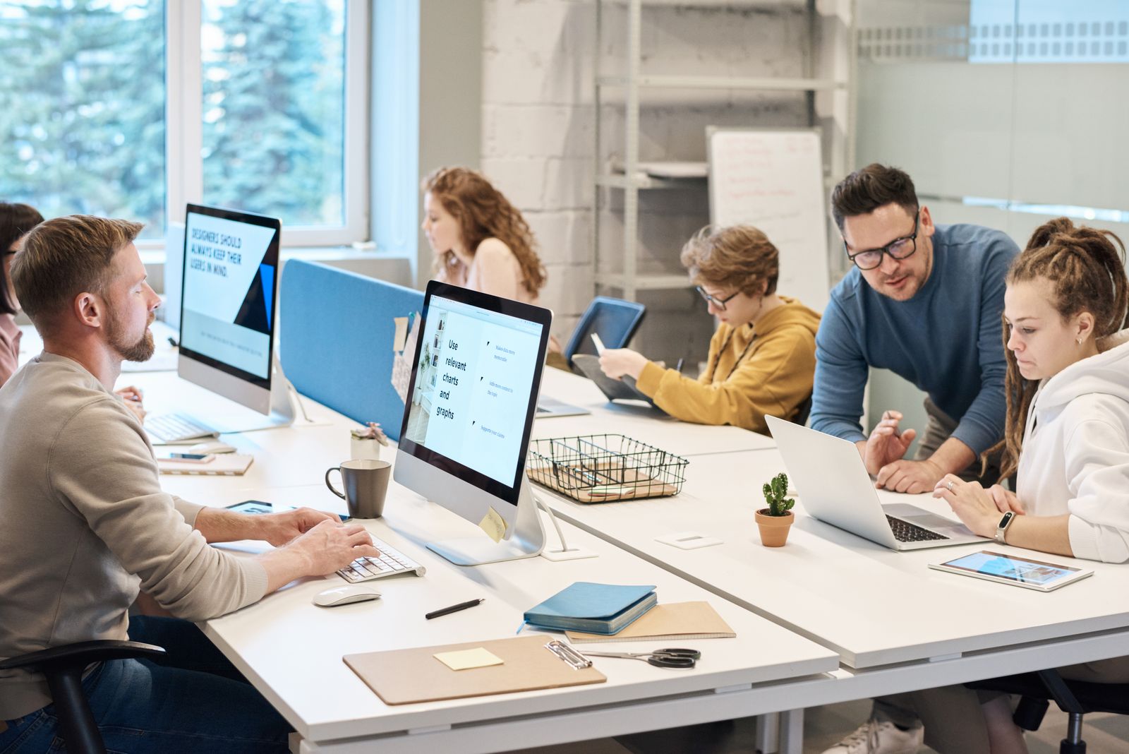 Small business team working at computers in a bright Central Florida office