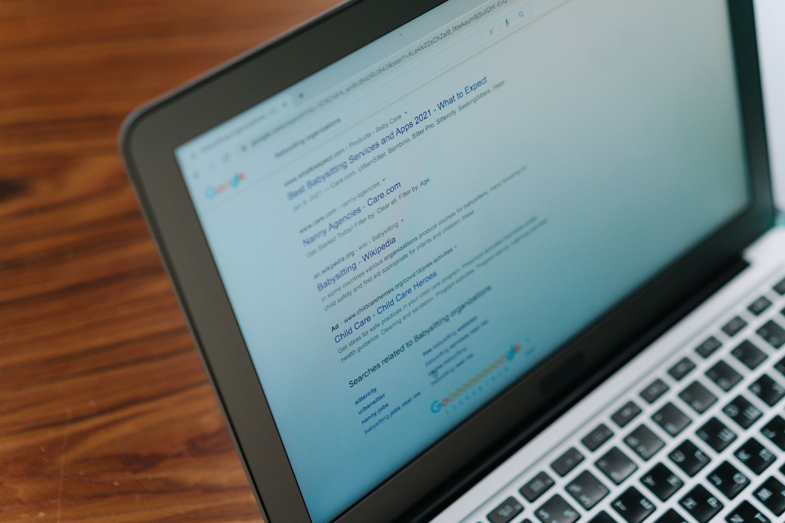 Laptop showing a page of Google search results