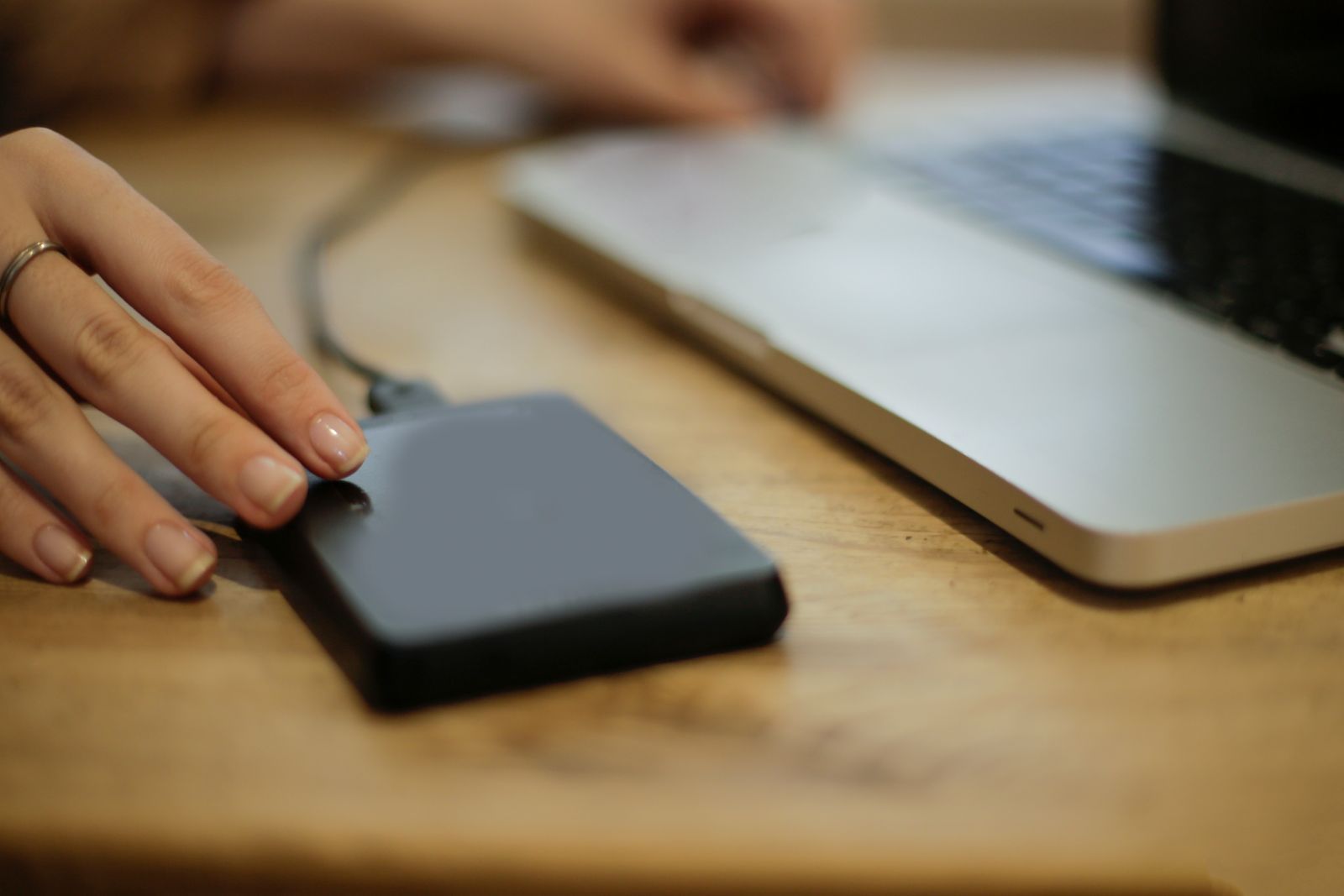 Connecting an external backup drive to a laptop to test a data restore
